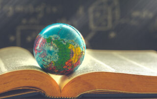 humanities education, globe on book