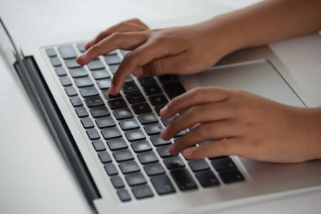 student using laptop to take digital psat